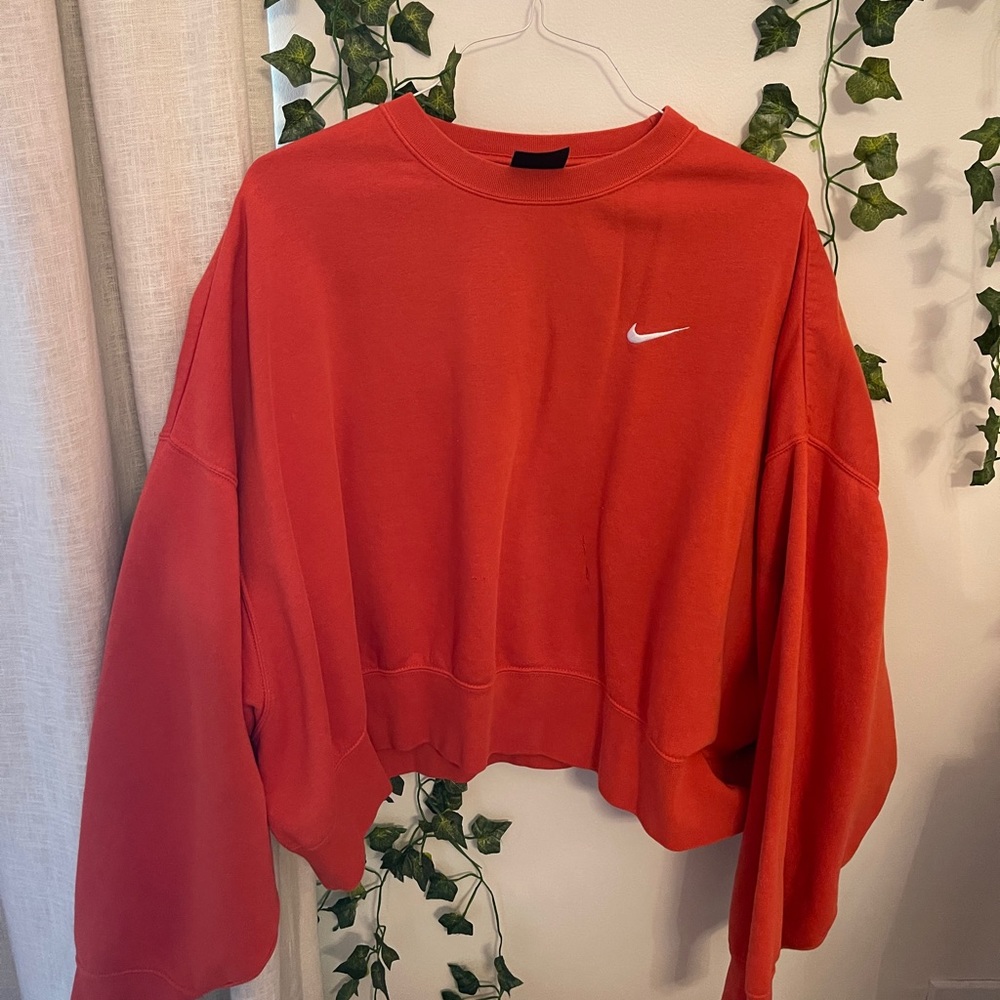 worn orange nike pullover size XL
